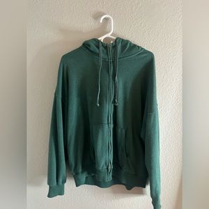 green zip up hoodie